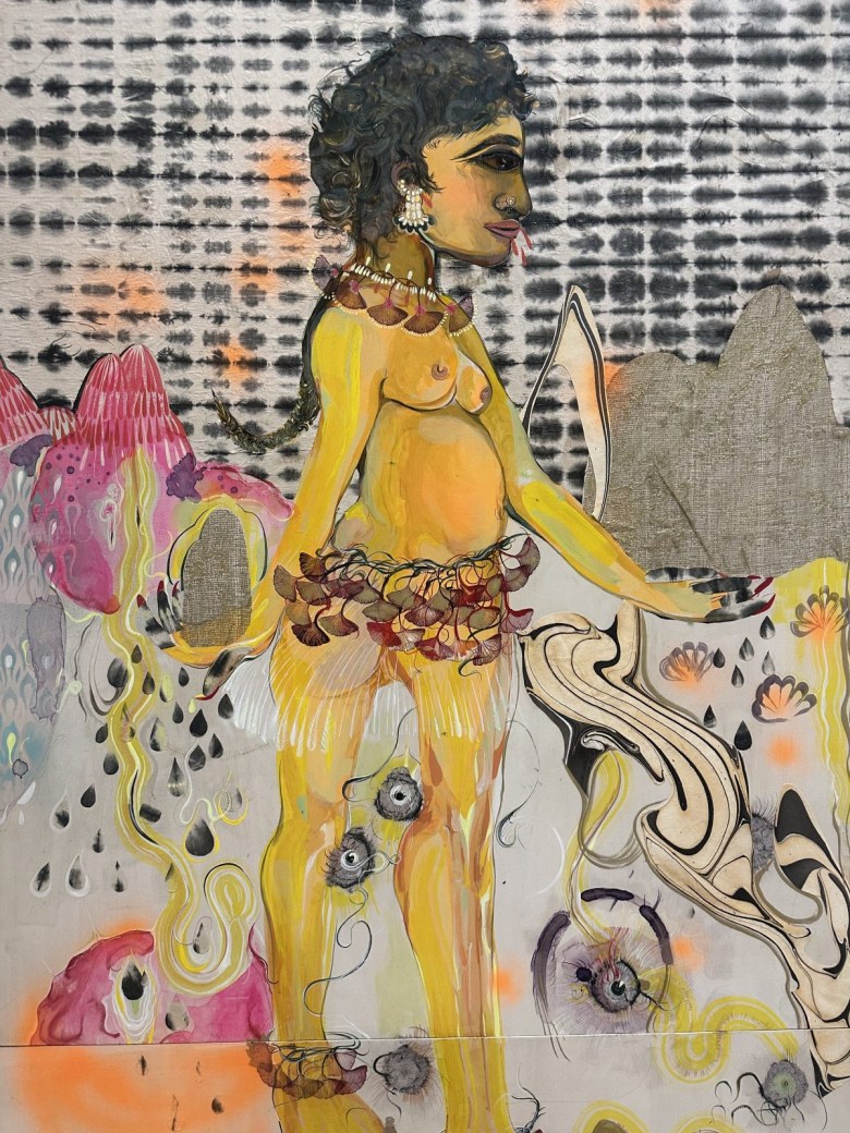Detail of Rina Banerjee, “Not like Superman, a superwoman, unlike kryptonite, like a Native of your country’s forrest, it’s soil is what you are and you trust, coined as home is, a currency weighted down in stones” (2018), ink and acrylic on two wooden panels