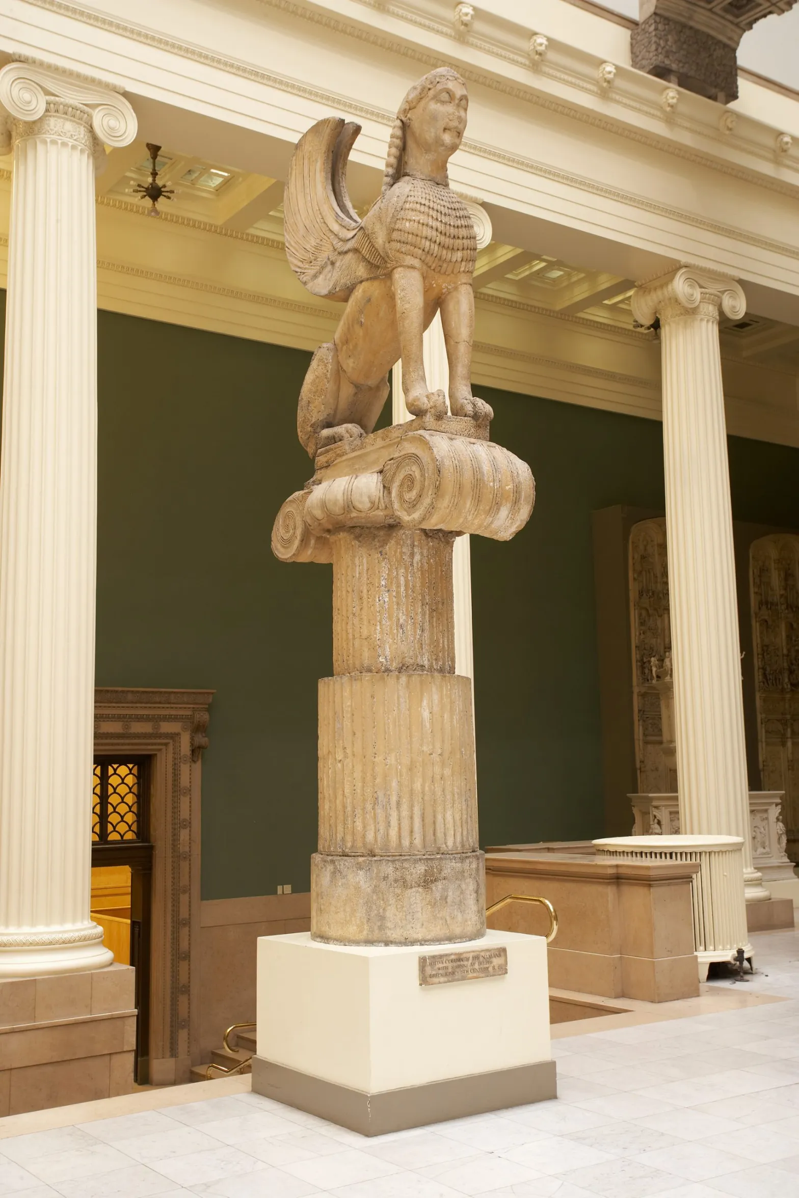 Left: Louvre Museum (cast maker), “Cast of Naxian Sphinx, Votive Column” (c. 1906) (photo by Tom Little)