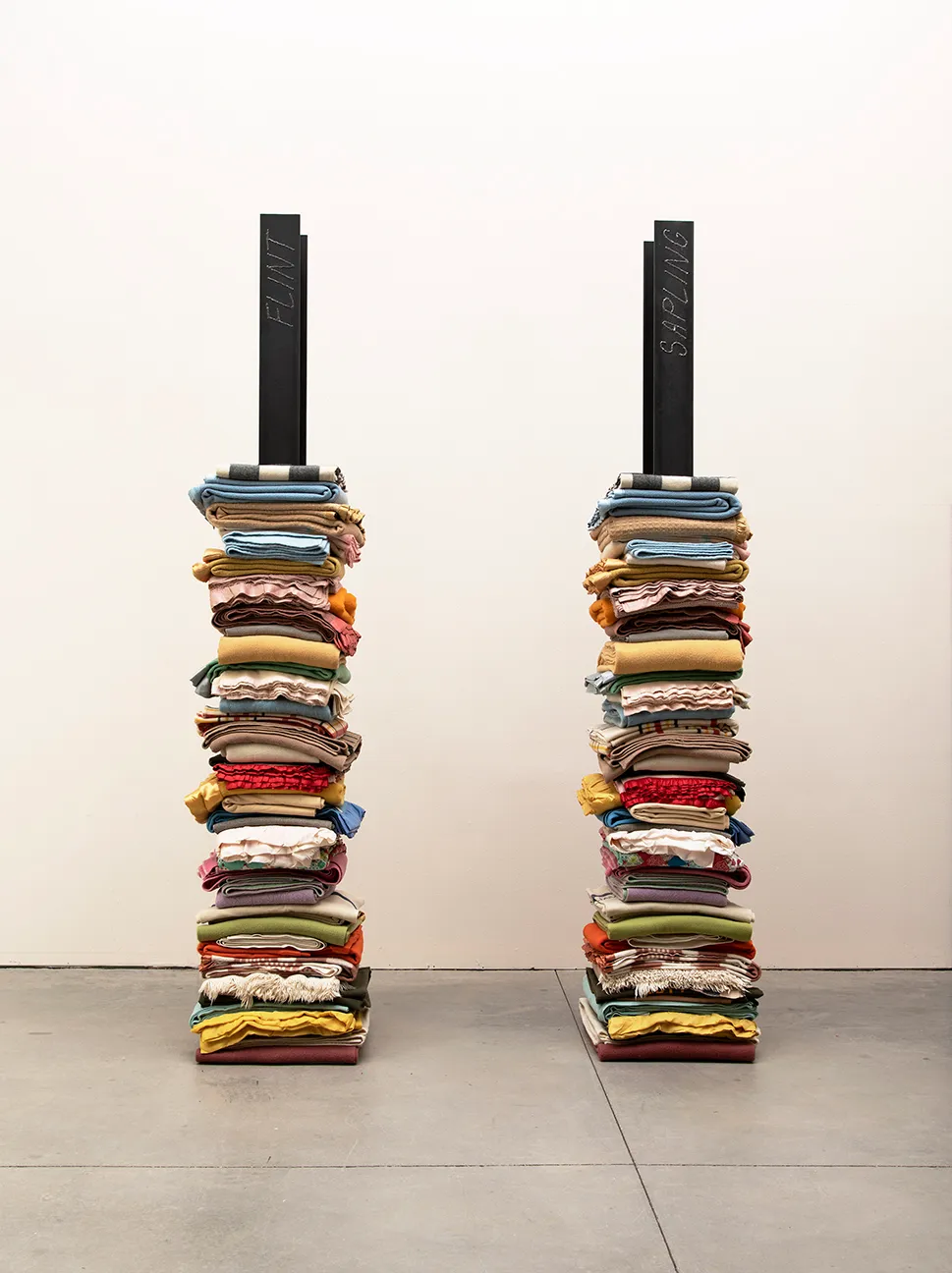 Marie Watt (Enrolled Member of the Seneca Nation of Indians/European Descent), “Skywalker/Skyscraper (Twins)” (2020), reclaimed wool blankets, steel I-Beams, two textile towers