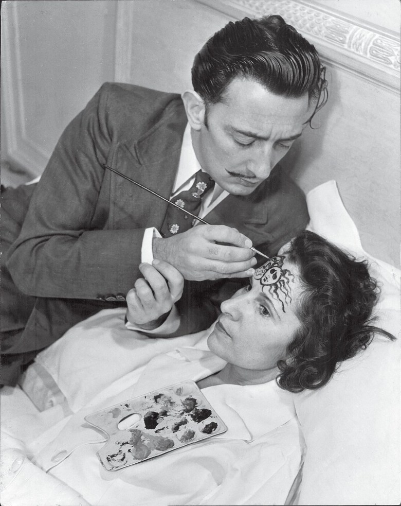 Gala asked Philippe Halsman to photograph her and Salvador in 1942. The original Toronto Star caption to the photo, taken in their suite at the St. Regis Hotel in New York, reads: “On his wife’s forehead, Salvador Dali paints the head of Medusa, one of the three snaky-haired Gorgon sisters whose glance turned into stone everything on which it rested. Mrs. Dali looks serious, as well she might, at the thought of carrying wherever she goes a threat like that.” (image via Getty Images, courtesy Harper)